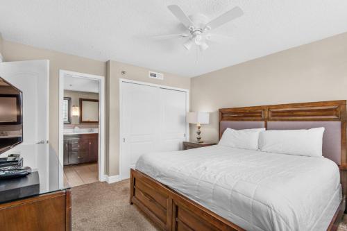 a bedroom with a bed and a ceiling fan at The Islander 214 in Destin