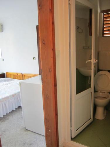a bathroom with a toilet and a sink at Central Guesthouse in Nesebar