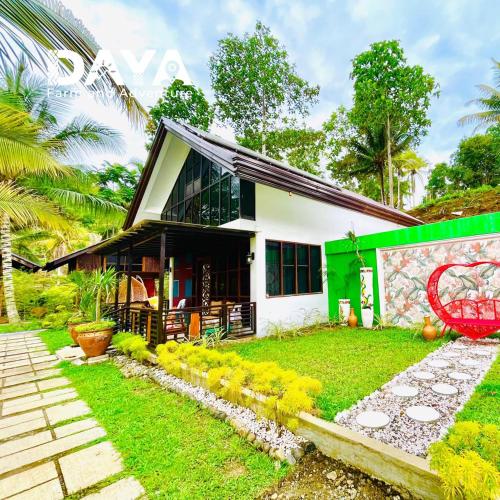 a house with a garden in front of it at Daya Farm and Adventure in Banay-Banay