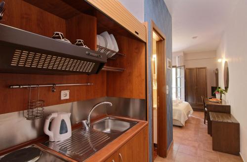 A kitchen or kitchenette at Enalion Hotel