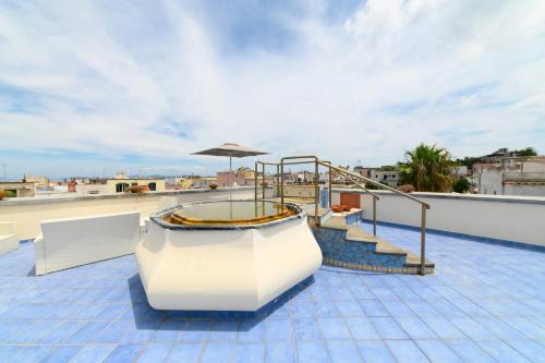 a hot tub on the roof of a building at Hotel Terme Oriente - Beach & SPA in Ischia