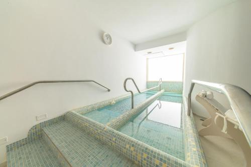 a swimming pool in a hospital room with at Hotel Terme Oriente - Beach & SPA in Ischia