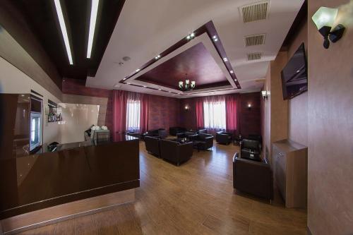 a salon with couches and a waiting room at Alpina Resort by Stellar Hotels, Tsaghkadzor in Tsaghkadzor