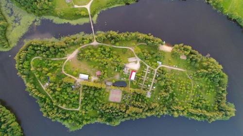 an aerial view of an island in the water at Obuoliu sala Moletu Vila in Gaylyunay