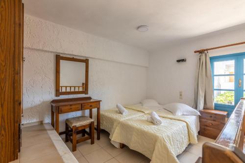 Ένα ή περισσότερα κρεβάτια σε δωμάτιο στο Joanna Apartments 