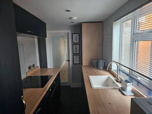 a kitchen with a sink and a counter top at Jubilee House in Newark upon Trent