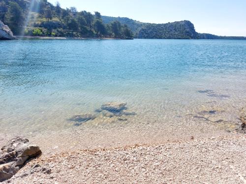 a large body of water with a rocky shore at Amari-Zaton in Zaton