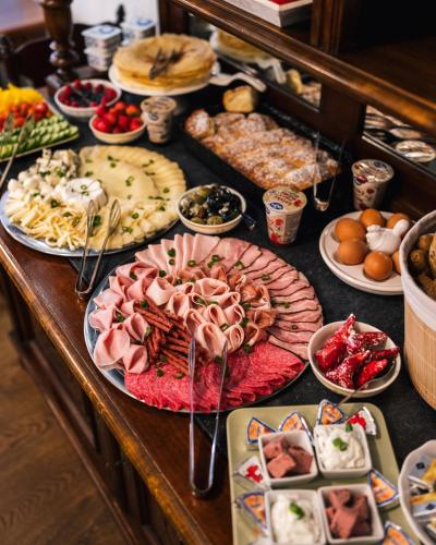 a buffet with many different types of food on a table at Sv. Hubertus in Český Krumlov