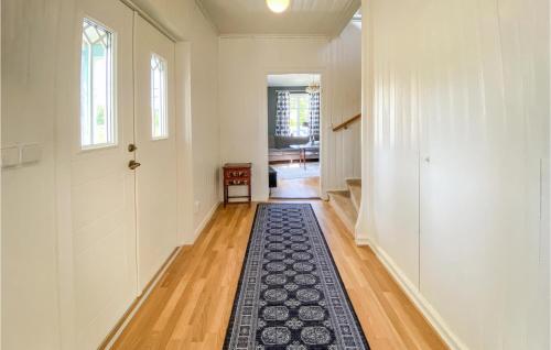 a hallway with a rug on the floor of a house at 2 Bedroom Gorgeous Home In Hyltebruk in Hyltebruk