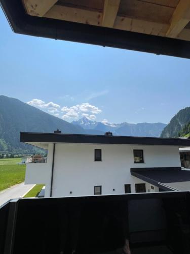 a view from the roof of a building with mountains in the background at Apart Egger in Schwendau