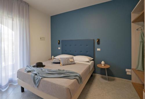 Ένα ή περισσότερα κρεβάτια σε δωμάτιο στο Hotel Residence Torre Del Porto