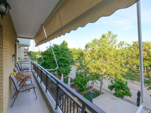 an outdoor balcony with a view of a street at SOSEA in Alexandroupoli