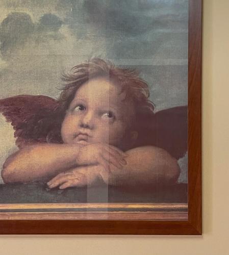 a painting of a woman with her arms crossed at B&B Le Principesse in Rossano Stazione