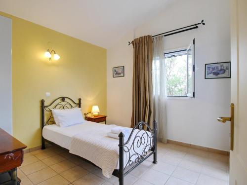 A bed or beds in a room at Villa Hera