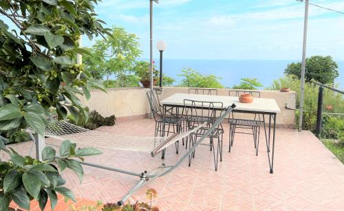 a table and chairs sitting on a patio at Appartamenti Miramare in Collina in Ischia