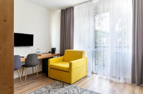 Televiisor ja/või meelelahutuskeskus majutusasutuses Bukville Hotel & SPA