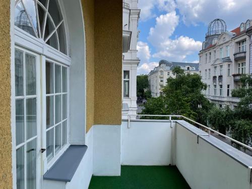 a balcony with a view of a city at Hotel Castell am Kurfürstendamm in Berlin