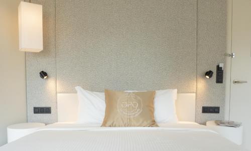 Letto o letti in una camera di OPO Hotel