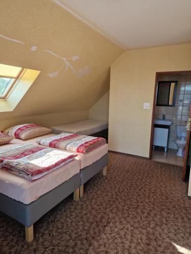 a bedroom with two beds in a room at LAZUR in Gąski