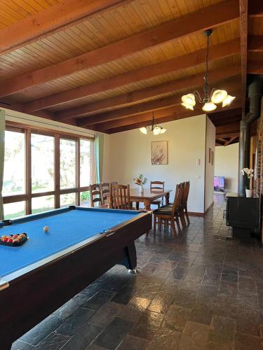 a room with a pool table and a dining room at Wandjoo Cottage Cranbourne in Lyndhurst South