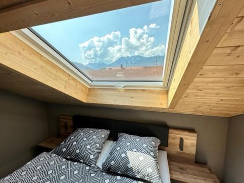 Tempat tidur dalam kamar di Ferienwohnungen WahlHeimat-Pfronten