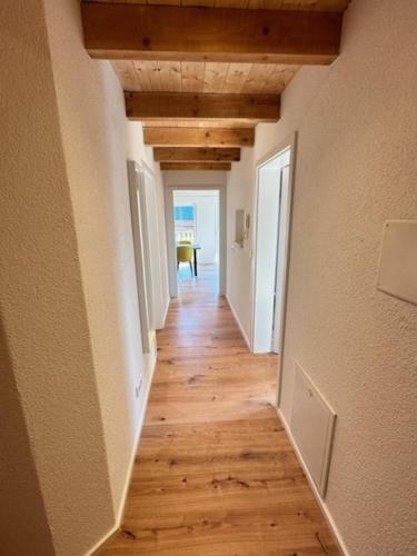 a hallway of a house with wooden floors and ceilings at Ferienwohnungen WahlHeimat-Pfronten in Pfronten
