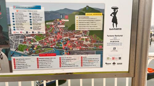 a sign with a map of the attraction at Exclusivo "Gran Bilbao" Suite Deluxe PARKING OPCIONAL in Santurce