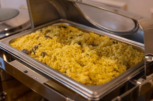 a casserole dish of food in an oven at Hotel Residence Plaza in Tbilisi City