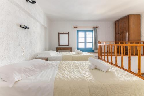 Ένα ή περισσότερα κρεβάτια σε δωμάτιο στο Joanna Apartments 