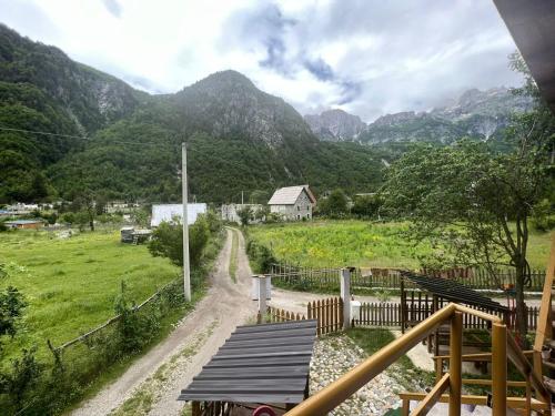 a view of a field with mountains in the background at GUEST HOUSE “ Center Theth “ in Theth