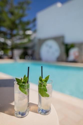 two glasses of water with mint on a table at Anemomilos Beach hotel in Agia Anna Naxos