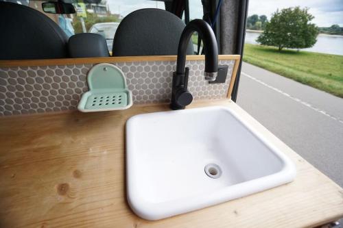 a sink on a table in a bus at Transi the Van in Düsseldorf
