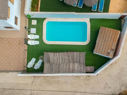 an overhead view of a swimming pool in a building at Chalet Privado Rural Barbate in Barbate