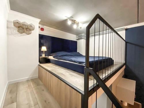 a bedroom with a bunk bed and a staircase at Airport Apartment in Wrocław