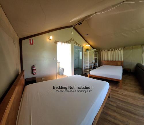 a bedroom with a bed and a bed not included at Southern Sky Glamping in Mount Tamborine