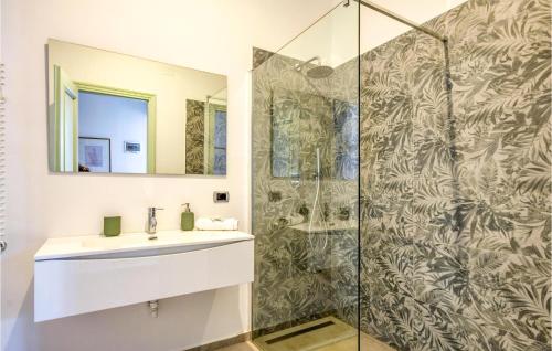 a bathroom with a sink and a shower at Lovely Apartment In Genova With Wifi in Genova