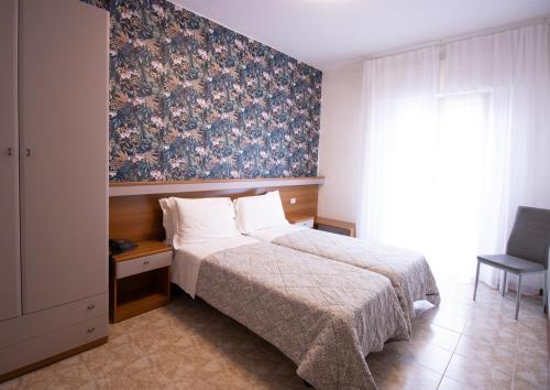 Postel nebo postele na pokoji v ubytování Hotel Crystal
