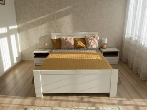 Apartamenty Pod Fortami tesisinde bir odada yatak veya yataklar