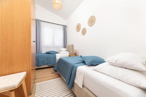 Ένα ή περισσότερα κρεβάτια σε δωμάτιο στο Apartments Maja