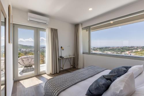 Una cama o camas en una habitación de Villa Callista