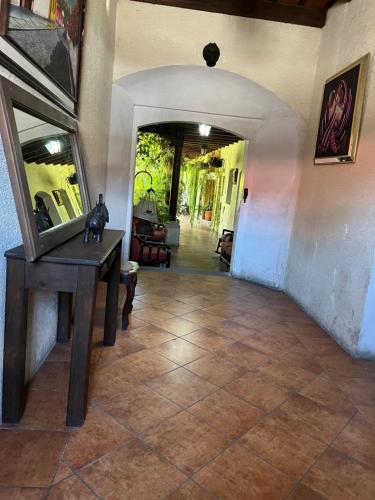 a room with a table with a mirror on it at Casa del viajero colonial in Antigua Guatemala