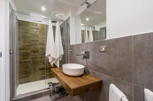 a bathroom with a sink and a shower at Il respiro di Encelado B&B in Catania