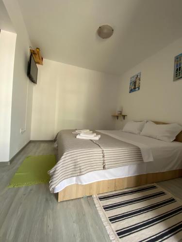 Кровать или кровати в номере Casa Ancutei