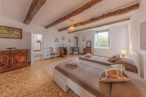 a large bedroom with two beds and a kitchen at Casa Otti by PortofinoHomes in Santa Margherita Ligure