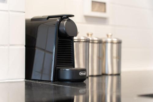 a coffee maker sitting on top of a kitchen counter at Agrippas St 8 - Isrentals in Jerusalem