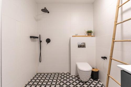 a bathroom with a toilet and a sink at Agrippas St 8 - Isrentals in Jerusalem