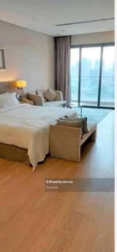 Ein Bett oder Betten in einem Zimmer der Unterkunft Fraser Residence 188 suites