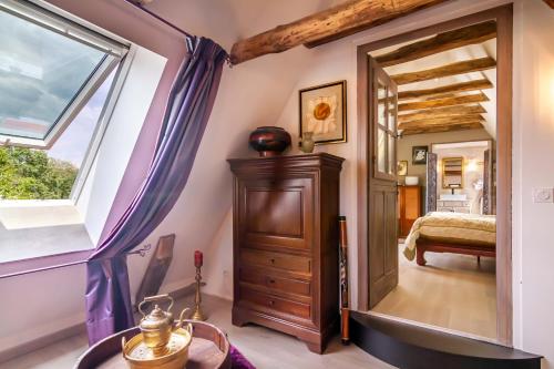 a room with a door leading to a bedroom at Le Mas de Monsieur in Carlux