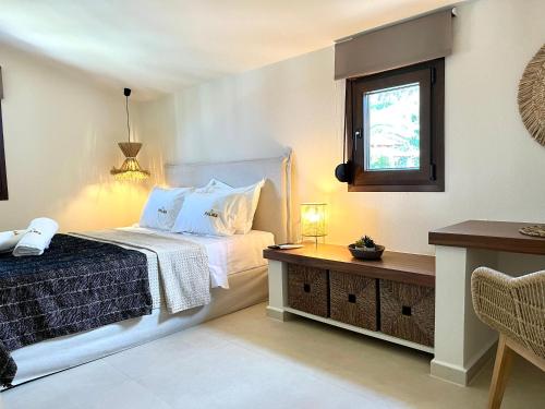 a bedroom with a bed and a window at Palma Seaside Villa 3 in Sarti