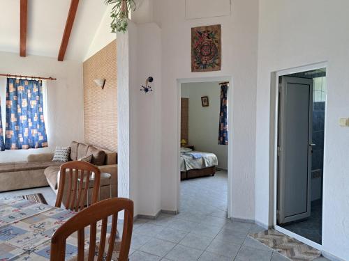 a living room with a couch and a table at Villa Veneta in Sinemorets